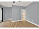 The bedroom features hardwood floors, gray walls, white trim, and a doorway that leads to another room at 271 Brooks Rackley Rd, Dallas, GA 30157