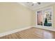 Sun-filled bedroom featuring hardwood flooring, base trim, and a garden view at 271 Brooks Rackley Rd, Dallas, GA 30157