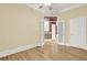 Large bedroom with hardwood floors, and bright window, showcasing the interior at 271 Brooks Rackley Rd, Dallas, GA 30157