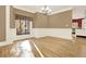 Bright dining room featuring hardwood floors, chair rail, and a window showcasing the wooded landscape at 271 Brooks Rackley Rd, Dallas, GA 30157