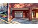 One-car garage in a red brick home, with a window and access to the beautiful outdoor scenery at 271 Brooks Rackley Rd, Dallas, GA 30157