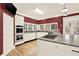 Gourmet kitchen with stainless steel appliances, stone countertops, and a view of the trees at 271 Brooks Rackley Rd, Dallas, GA 30157