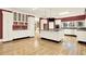 Spacious kitchen with white cabinetry, large island, granite countertops and stainless steel appliances at 271 Brooks Rackley Rd, Dallas, GA 30157