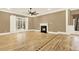 Bright living room featuring a cozy fireplace, large window, and natural light at 271 Brooks Rackley Rd, Dallas, GA 30157