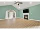 Living room with fireplace, vaulted ceiling, and natural light from large window at 271 Brooks Rackley Rd, Dallas, GA 30157