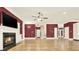 Spacious living room featuring a cozy fireplace and contemporary design, enhanced by natural light and hardwood floors at 271 Brooks Rackley Rd, Dallas, GA 30157
