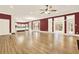 Spacious living room features hardwood floors, ceiling fan, and large windows overlooking the yard at 271 Brooks Rackley Rd, Dallas, GA 30157
