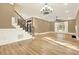 A bright living room featuring hardwood flooring, a ceiling fan and a staircase at 271 Brooks Rackley Rd, Dallas, GA 30157