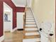 Staircase with wooden banister, stairlift, and access to the upper level at 271 Brooks Rackley Rd, Dallas, GA 30157