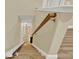 Wooden staircase featuring a chair lift and wood railing at 271 Brooks Rackley Rd, Dallas, GA 30157