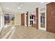 Sunroom with tile flooring, brick accent wall, and great natural light at 271 Brooks Rackley Rd, Dallas, GA 30157