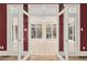 Bright sunroom featuring white trim, large windows, and glass doors leading to outdoors at 271 Brooks Rackley Rd, Dallas, GA 30157