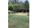 Large grassy backyard with mature trees at 3554 Umatilla Sw Ln, South Fulton, GA 30331