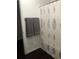 Clean bathroom with shower, tub, and updated shower curtain at 3554 Umatilla Sw Ln, South Fulton, GA 30331