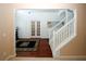 White staircase with wooden railing leading to the second floor at 3554 Umatilla Sw Ln, South Fulton, GA 30331