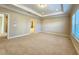 Large main bedroom with trey ceiling and en-suite bath at 4421 Samford Park Ave, Sugar Hill, GA 30518