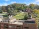 Aerial view of the building featuring a rooftop area, mature trees, and meticulously kept grounds at 351 Washington Ne Ave # 302, Marietta, GA 30060