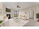 Bright living room with a fireplace, a ceiling fan, and access to a balcony at 351 Washington Ne Ave # 302, Marietta, GA 30060