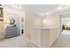 Upstairs hallway with wall-mounted shelves and dresser at 3829 Reece Farms Ct, Powder Springs, GA 30127