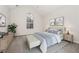 Comfortable bedroom with vaulted ceiling, large window, and stylish furniture at 254 Cobblestone Ln, Mcdonough, GA 30252