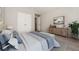 Calm bedroom with large closet doors, natural light, and neutral decor at 254 Cobblestone Ln, Mcdonough, GA 30252