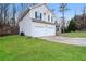 Two-story house with a two-car garage and grassy yard at 254 Cobblestone Ln, Mcdonough, GA 30252