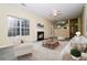 Bright living room with fireplace, plush seating, and open access to kitchen at 254 Cobblestone Ln, Mcdonough, GA 30252