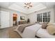 Serene main bedroom with trey ceiling, ceiling fan, and a large window at 254 Cobblestone Ln, Mcdonough, GA 30252