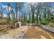 A large and overgrown backyard with a shed and concrete wall at 1196 Oleander Nw St, Atlanta, GA 30314