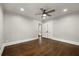 Large bedroom featuring hardwood floors, ceiling fan, and a closet with double doors at 1196 Oleander Nw St, Atlanta, GA 30314