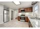 Charming kitchen featuring stainless steel appliances, tiled floors, and natural light at 1196 Oleander Nw St, Atlanta, GA 30314