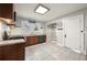 Bright kitchen featuring granite countertops, stainless steel appliances, and tile flooring at 1196 Oleander Nw St, Atlanta, GA 30314