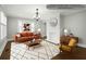 Staged living room showcasing a modern fireplace, stylish furniture, and artful decor at 1196 Oleander Nw St, Atlanta, GA 30314