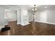 Spacious living room featuring hardwood floors, white fireplace, and open layout for entertaining at 1196 Oleander Nw St, Atlanta, GA 30314