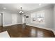 Bright living room featuring hardwood floors, fresh paint, and ample sunlight from multiple windows at 1196 Oleander Nw St, Atlanta, GA 30314