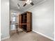 A small room with a built-in cabinet that's unfolded as a desk and shelving unit at 1196 Oleander Nw St, Atlanta, GA 30314