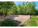 Outdoor basketball court nestled in a wooded area at 6220 Vickery Creek Rd, Cumming, GA 30040