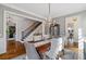 Bright dining room with hardwood floors and a view of the staircase at 6220 Vickery Creek Rd, Cumming, GA 30040