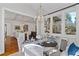 Sunlit dining area with table and chairs, open to kitchen at 6220 Vickery Creek Rd, Cumming, GA 30040