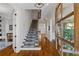 Grand entryway with hardwood floors and staircase at 6220 Vickery Creek Rd, Cumming, GA 30040