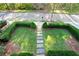 Elevated view of a well-manicured front yard with a stone pathway at 6220 Vickery Creek Rd, Cumming, GA 30040