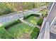 Elevated view of charming front yard, showcasing manicured hedges and stone pathway at 6220 Vickery Creek Rd, Cumming, GA 30040