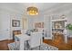 Bright home office with built-in shelving and French doors leading to dining room at 6220 Vickery Creek Rd, Cumming, GA 30040