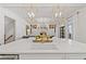 Elegant kitchen with large island, quartz countertops, and gold light fixtures at 6220 Vickery Creek Rd, Cumming, GA 30040