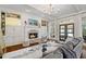 Cozy living room with fireplace and built-in shelving at 6220 Vickery Creek Rd, Cumming, GA 30040