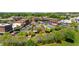 Aerial view of a vibrant town square with shops and green spaces at 6220 Vickery Creek Rd, Cumming, GA 30040