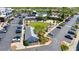 Aerial view of a town square with ample parking and green spaces at 6220 Vickery Creek Rd, Cumming, GA 30040