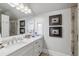 Bathroom with white vanity, marble countertop, and walk-in shower at 6715 Berkley Rd, Cumming, GA 30040