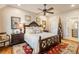 King bedroom with dark wood furniture and a red area rug at 6715 Berkley Rd, Cumming, GA 30040