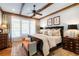 Bright and airy bedroom with hardwood floors and a ceiling fan at 6715 Berkley Rd, Cumming, GA 30040